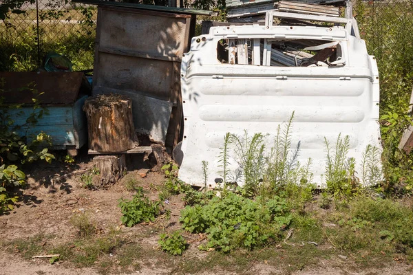 stock image Garbage in the backyard. Detail of the car body