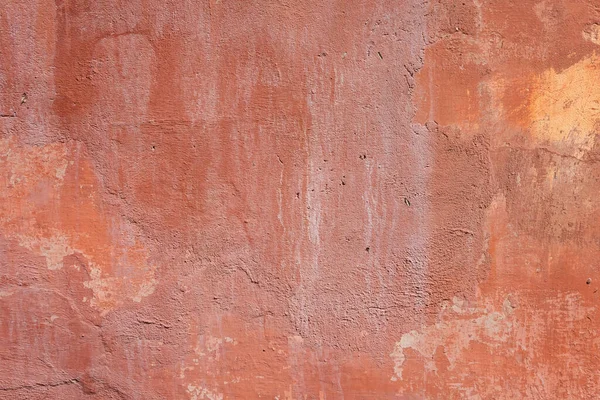 stock image Texture of old cement plaster painted red. Weathered painted wall background texture