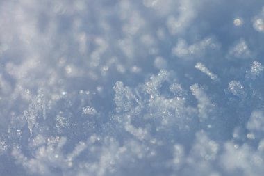 Soyut kış geçmişi. Kar kristalleri. Alanın küçük derinliği.
