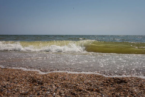 Sea view. Big and stormy waves of the Black Sea on a sunny day. Small depth of field