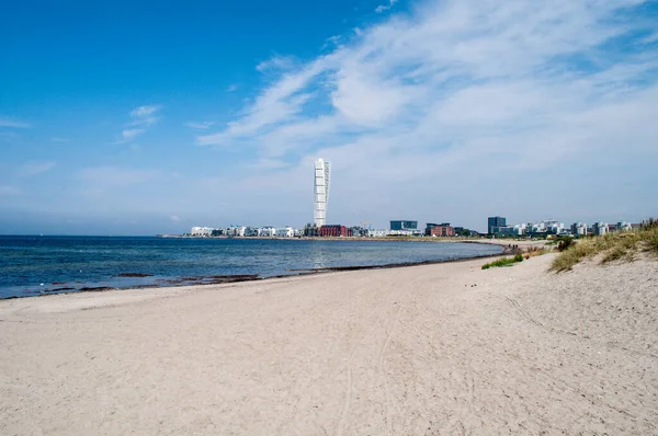 Sea coast with sandy beach and view of Malmo city, Sweden
