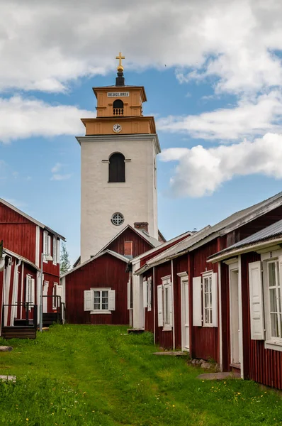 stock image Gammelstad, Lulea, Sweden - street with small red historic wooden houses. A protected heritage village in the north of Europe.