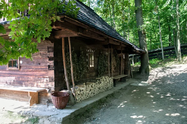 Old wooden house in the forest with inlaid wood. Roznov, Czech Republic.