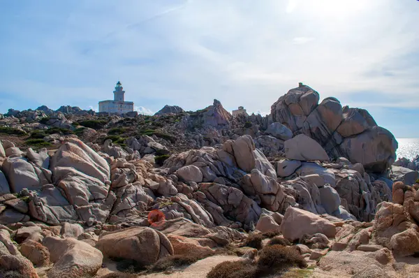 stock image Rocky sea coast with a lighthouse in the Capo D'Orso area on the island of Sardinia, Italy