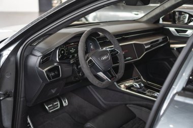 Brno, Czech Republic - March 21, 2024: Interior of expensive Audi luxury car. Steering wheel and dashboard in a car. clipart