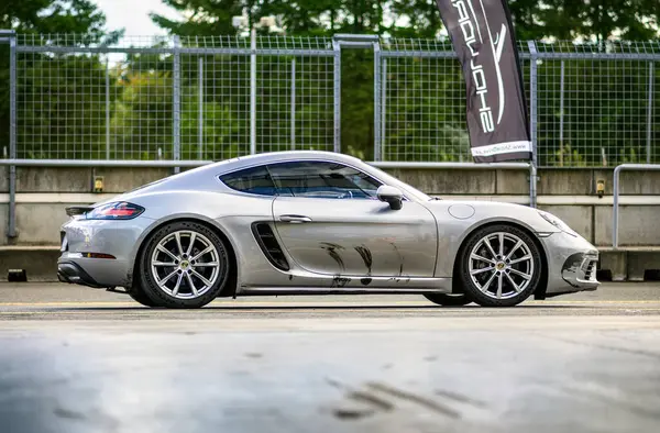 stock image Brno, Czech Republic - September 24, 2024: Porsche 911 fast sports car parked outside on the street. Luxury silver coupe.