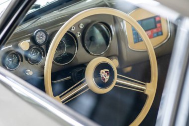 Brno, Czech Republic - October 15, 2024: Detail of the interior of an old fast car. Classic Porsche car made in the 80s. clipart