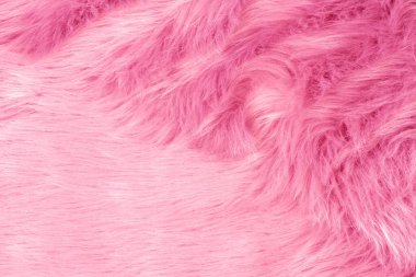 Pink fur texture top view. Pink sheepskin background. Fur pattern. Texture of pink shaggy fur. Wool texture. Sheep fur close up