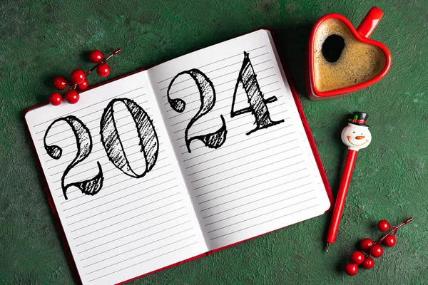 New year resolutions 2024 on desk. 2024 goals list with notebook, coffee cup on green table. Resolutions, plan, goals, action, checklist, idea concept. New Year 2024 resolutions, copy space