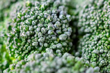 Brokoli deseni. Makro fotoğraf yeşil brokoli dokusu. Taze yeşil brokoli sebzesi. Diyet ve sağlıklı yiyecekler için sebzeler. Organik yiyecekler
