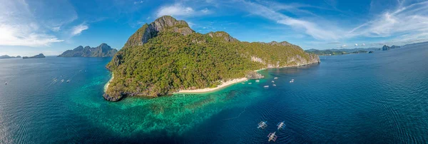 Drone panorama of the paradisiacal Seven Commandos beach near El Nido on the Philippine island of Palawan during the day