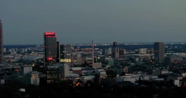 Drone panc over Frankfurt am Main skyline in the evening light in summer