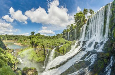 Panoramic image over the impressive Iguacu waterfalls in Brazil during daytime clipart