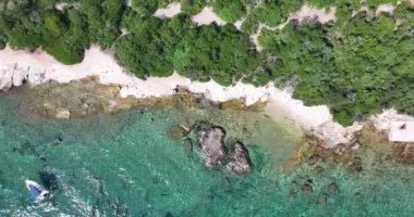 Vertical drone video over a stretch of coast near the town of Pula in Istria during the day
