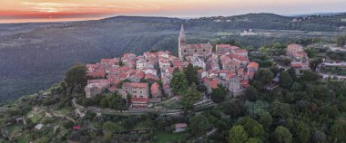 Drone panorama over the historic artists' town of Groznjan in central Istria at sunset in summer
