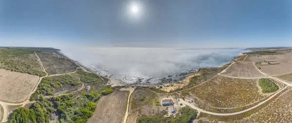 Drone panorama over rocky Atlantic coast in Portugal in morning light