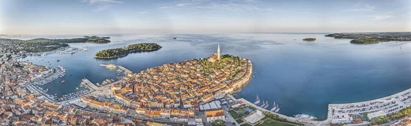 Drone image of the historic Croatian coastal town of Rovinj during sunrise in summer