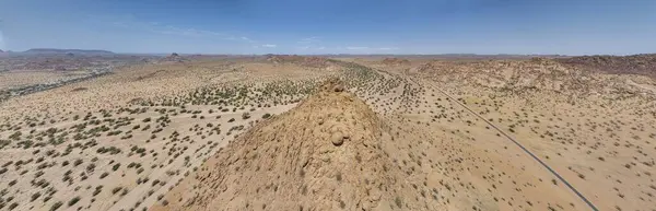 Drone panorama over the Namibian desert landscape near Twyfelfontein during the day in summer