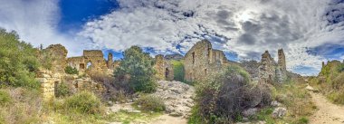 Panoramic view of the ruins in the abandoned historic village of Occi in western Corsica in summer clipart