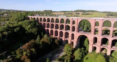 Drone video of the Goeltschtal Bridge, the worlds largest stone bridge, near Reichenbach in Saxony at sunset