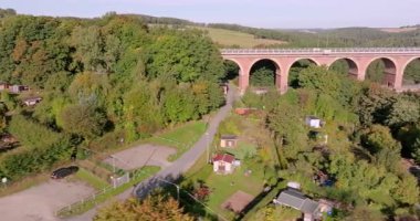 Drone video of the Goeltschtal Bridge, the worlds largest stone bridge, near Reichenbach in Saxony at sunset