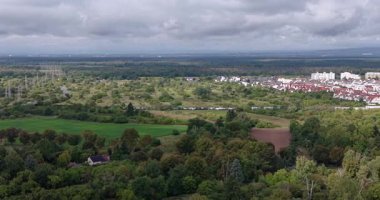 Drone time-lapse video of a flight towards the Frankfurt skyline with fast-moving clouds in summer