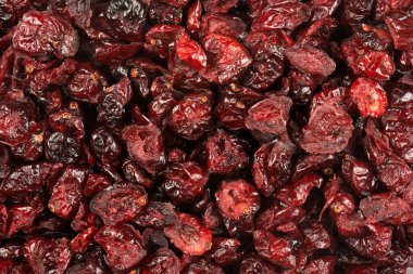 Evenly scattered dried cranberries. Whole and cut fruit visible. 
