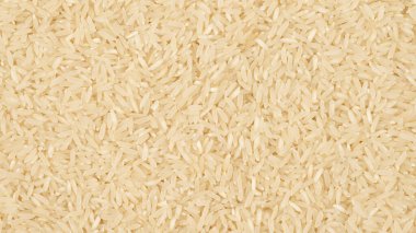 Randomly scattered grains of rice visible from above.