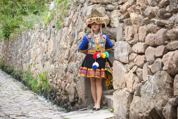 stock image Beautiful girl with traditional dress from Peruvian Andes culture. Young girl in Ollantaytambo city in Incas Sacred Valley in Cusco Peru.