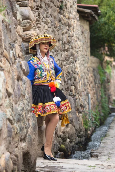 stock image Beautiful girl with traditional dress from Peruvian Andes culture. Young girl in Ollantaytambo city in Incas Sacred Valley in Cusco Peru.