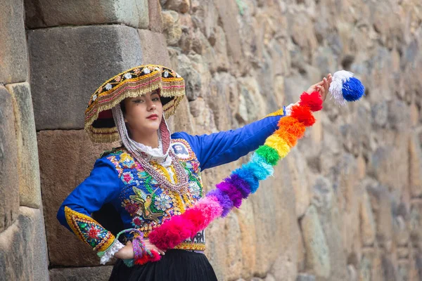 stock image Beautiful girl with traditional dress from Peruvian Andes culture. Young girl in Ollantaytambo city in Incas Sacred Valley in Cusco Peru.