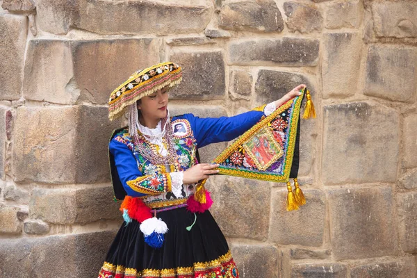 stock image Beautiful girl with traditional dress from Peruvian Andes culture. Young girl in Ollantaytambo city in Incas Sacred Valley in Cusco Peru.