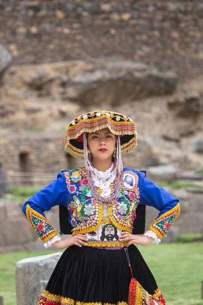 stock image Beautiful girl with traditional dress from Peruvian Andes culture. Young girl in Ollantaytambo city in Incas Sacred Valley in Cusco Peru.