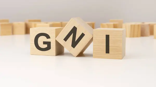 stock image GNI, word concept on wooden blocks, text letters