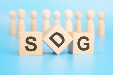 Önplanda bloklar olan kavramsal bir kelime oluşturmak - SDG. Şu anda karar vermenin ve harekete geçmenin önemini vurgular..