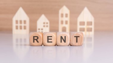 Temsil, kiralık konutları blokların arasında RENT ve ahşap evlerin siluetlerini gösteriyor.