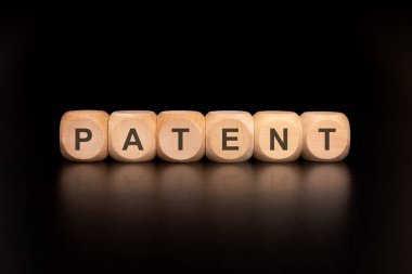 İnovasyon ve fikri mülkiyet haklarını sembolize eden, PATENT kavramını gösteren görsel bir temsil
