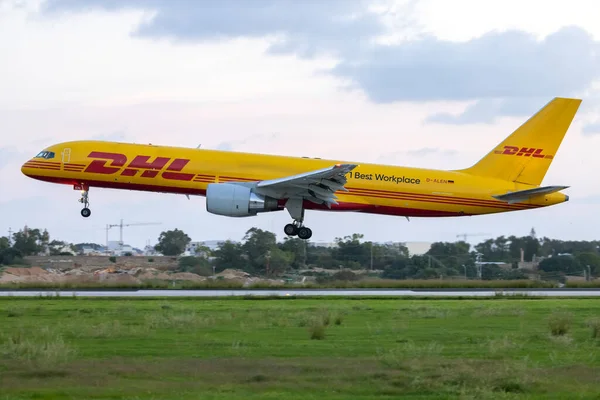 stock image Luqa, Malta - November 28, 2022: DHL (European Air Transport - EAT) Boeing 757-2Q8(PCF) (REG: D-ALEN) with No. 1 Best workplace sticker.