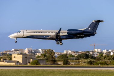 Luqa, Malta - April 16, 2023: FlyJet KZ Embraer Legacy 600 (EMB-135BJ) (REG: UP-EM019) on finals runway 31. clipart