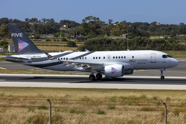 stock image Luqa, Malta - April 29, 2023: Comlux Aviation Malta Airbus A220-100 (ACJ) (Reg: 9H-FIVE) landing for the first time on the island.