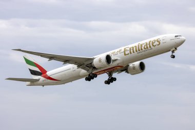 Luqa, Malta - May 8, 2023: Emirates Boeing 777-31H-ER (REG: A6-EGQ) on take off from runway 13. clipart