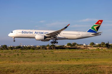 Luqa, Malta - July 4, 2023: South African Airways Airbus A350-941 (Reg: OE-IPK, Ex ZS-SDC) taken out of storage, to join Lufthansa soon. clipart