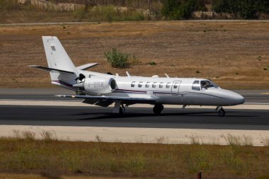 Luqa, Malta - July 20, 2023: Brownstone Aviation Cessna 560 Citation Encore (Reg: P4-BSA) braking runway 31.