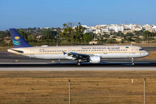 stock image Luqa, Malta - August 1, 2023: Saudi Arabian Airlines Airbus A321-211 (REG: HZ-ASN) arriving in the morning for servicing at LTM.