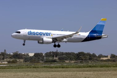 Luqa, Malta - March 28, 2024: Discover Airlines Airbus A320-214 (REG: D-AIUU) landing runway 31. clipart
