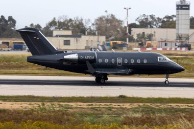 Luqa, Malta - April 15, 2024: MHS Aviation Bombardier Challenger 604 (CL-600-2B16) (REG: D-AEOM) arriving from Milan as flight MHV64M. clipart