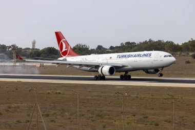 Luqa, Malta - August 18, 2024: Turkish Airlines Airbus A330-203 (REG: TC-JND) on the morning flight from Istanbul. clipart