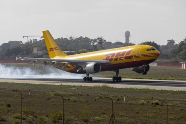 Luqa, Malta - October 10, 2024: DHL (European Air Transport - EAT) Airbus A300B4-622R(F) (REG: D-AEAA) replacing the usual 757 cargo. clipart