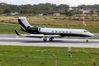 Luqa, Malta - December 3, 2024: Avcon Jet Gulfstream Aerospace G-V Gulfstream V (REG: OE-IIS) landing runway 31 on a cloudy morning. clipart