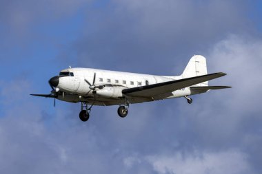 Luqa, Malta - January 11, 2025: National Test Pilot School Douglas DC-3-65TP (REG: N882TP) on finals runway 31. Built in 1945, this airframe is 80 years old. clipart